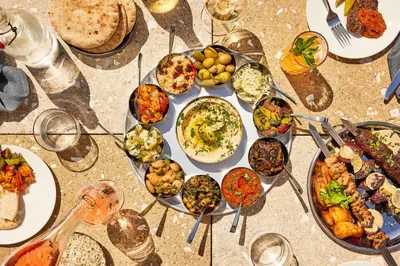 a table with a bunch of different types of food at The Hoxton, Williamsburg in Brooklyn