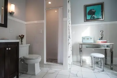 a bathroom with a shower and a toilet and a sink at Gardner Farm Inn in Troy