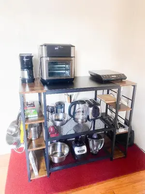 a table with a toaster oven and a microwave at 2 Bedrooms Entire Beautiful Apt in Williamsburg! in Brooklyn