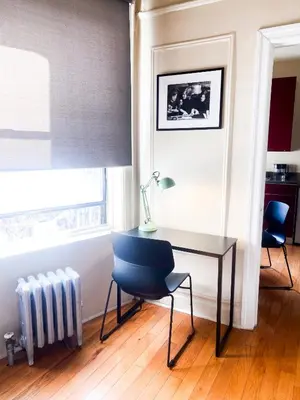 a desk with a chair and a radiator in a room at 2 Bedrooms Entire Beautiful Apt in Williamsburg! in Brooklyn