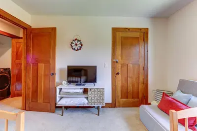 a living room with a couch and a tv at Peaceful Mountian Oasis Firepit, Hot Tub, Sauna! in Vernon Township