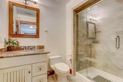a bathroom with a toilet and a shower at Peaceful Mountian Oasis Firepit, Hot Tub, Sauna! in Vernon Township