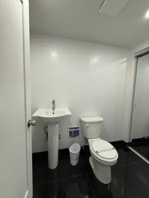 a bathroom with a toilet and a sink at 31 Street Broadway Hotel in New York