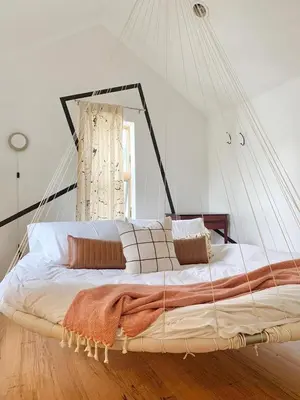 a bed in a room with a net at The Trail in Adams - Berkshires' Art Hotel in Adams