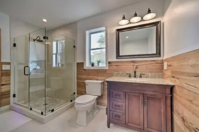 a bathroom with a shower and a toilet and a sink at Luxury Home with Deck Explore the Catskill Mtns! in Windham