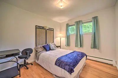 a bedroom with a bed and a desk and a computer at Albany Home with Fenced Yard and Patio - Pets Welcome! in Albany