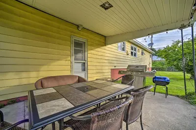 a table and chairs on the porch of a house at Albany Home with Fenced Yard and Patio - Pets Welcome! in Albany