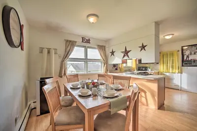 a kitchen and dining room with a table and chairs at Albany Home with Fenced Yard and Patio - Pets Welcome! in Albany