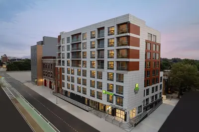 a rendering of a building on a city street at Holiday Inn Express & Suites Woodside LaGuardia Airport in Queens