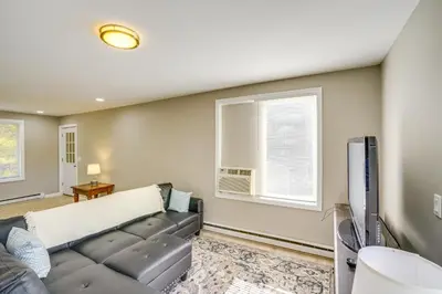 a living room with a couch and a tv at Relaxing Catskills Apt Less Than 3 Mi to Windham Mountain! in Windham