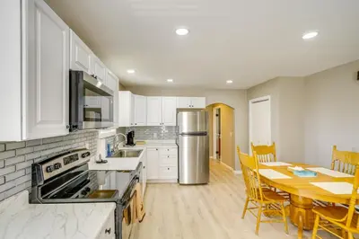 a kitchen and dining room with a table and chairs at Relaxing Catskills Apt Less Than 3 Mi to Windham Mountain! in Windham