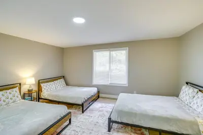 a bedroom with two beds and a window at Relaxing Catskills Apt Less Than 3 Mi to Windham Mountain! in Windham