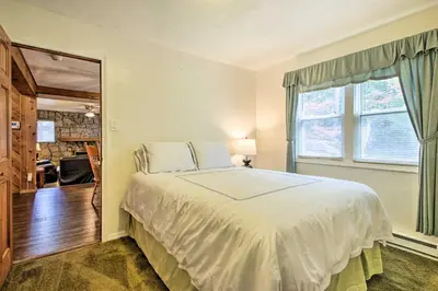 a bedroom with a large white bed and a window at Spacious Apt with Yard 3 Mi to Windham Mountain in Windham