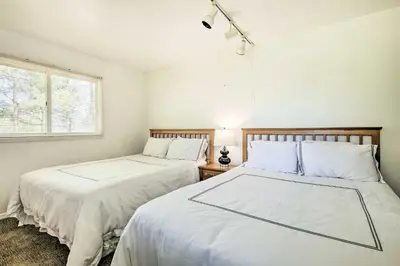 two beds sitting next to each other in a bedroom at Spacious Apt with Yard 3 Mi to Windham Mountain in Windham