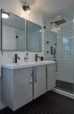 a bathroom with two sinks and a shower at Holly Lodge - Ski Windham Hunter Catskills in Prattsville