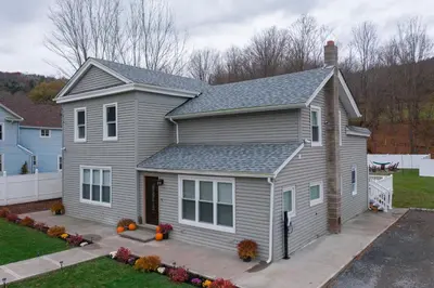 a house with a gray house at Holly Lodge - Ski Windham Hunter Catskills in Prattsville
