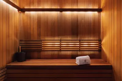 a sauna with a bench with a towel on it at Casa Cipriani New York in New York