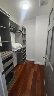 a room with a closet with a bed in it at Luxury Hotel-Style Room in Queens, New York in Bayside