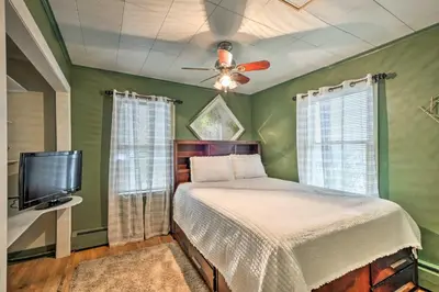 a green bedroom with a bed and a ceiling fan at Stylish Suburban Getaway, 10 Miles to Royal Mtn! in Johnstown