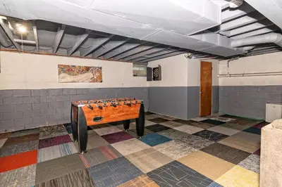 a ping pong table in the middle of a room at Camelback Rd Rancher- On ONE ACRE & near attractions in Tannersville