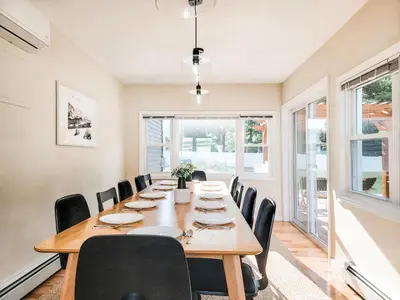 a large dining room with a long table and chairs at Chateau Lodge - Ski Shandaken, Hunter, Catskills, Windham, Belleayre in Shandaken