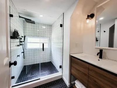 a bathroom with a shower and a sink at Chateau Lodge - Ski Shandaken, Hunter, Catskills, Windham, Belleayre in Shandaken