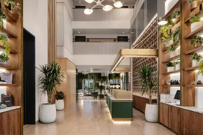 a lobby of a store with potted plants at Arlo Midtown in New York