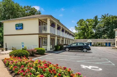 a car parked in a parking lot in front of a hotel at Quality Inn Poughkeepsie in Poughkeepsie