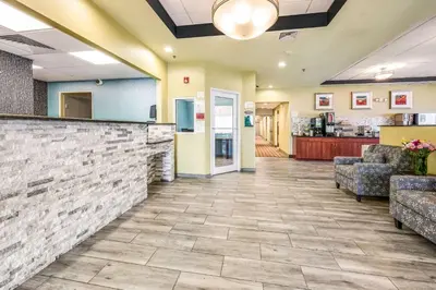 a lobby of a hospital with chairs and a counter at Rodeway Inn Poughkeepsie in Poughkeepsie