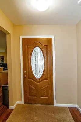 a wooden door with a window in a room at Cabin by the Creek with private creek access in Tannersville