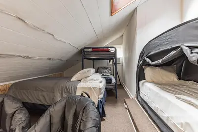 a room with two bunk beds in a tent at Two Brooks Lodge in Bennington