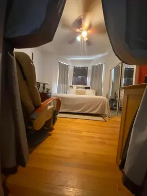 a bedroom with a bed and a ceiling fan at Nice 2 bedrooms, Massage Seat, close to New York, THE BEST CHOICE!! in North Bergen