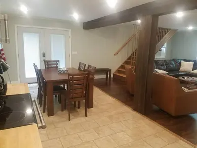 a kitchen and living room with a table and a couch at 1st Class Rentals Cooperstown New 3 Bedroom House in Cooperstown