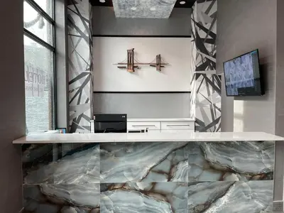 a lobby with a desk and a sign on the wall at Casa Blanca Hotel Brooklyn Downtown in Brooklyn