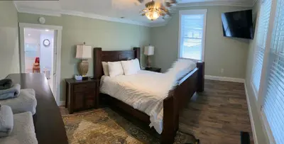 a bedroom with a large bed and a couch at 1st Class Rentals The Thurman Munson House in Cooperstown