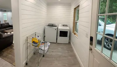 a laundry room with a washer and dryer in a house at 1st Class Rentals The Thurman Munson House in Cooperstown