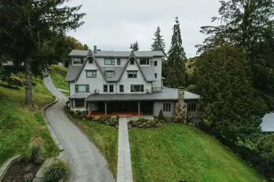 an aerial view of a large white house with a driveway at Callicoon Hills in Callicoon Center