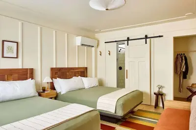 a hotel room with two beds and a bathroom at Callicoon Hills in Callicoon Center