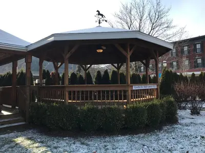 a wooden gazebo with a roof at Trout Town Inn in Roscoe