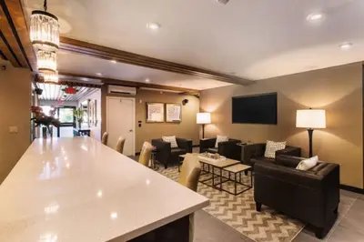a living room with a couch and a table at Fathoms Hotel & Marina in Port Washington