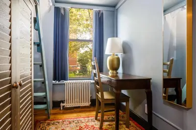 a home office with a desk and a window at Lamartine Chelsea in New York