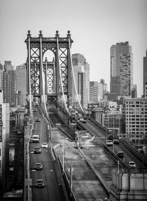 a black and white photo of a bridge in a city at Leon Hotel LES in New York