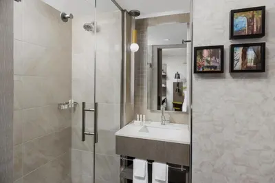 a bathroom with a sink and a shower at SpringHill Suites by Marriott New York Manhattan Chelsea in New York