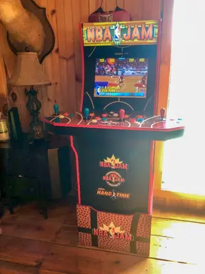 a video game machine in the corner of a room at Full Private Home on 32-Acres with Stellar Views! in North Blenheim