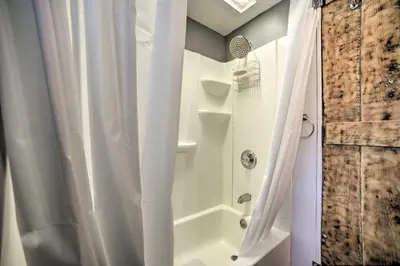 a bathroom with a shower with a shower curtain at Cozy Great Barrington Home about 1 Mi to Ski Resort! in Great Barrington