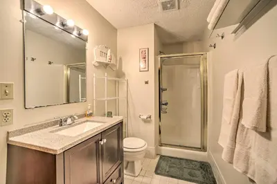 a bathroom with a shower and a sink and a toilet at Cozy Mountain Retreat with Deck about 3 Mi to Mount Snow in West Dover