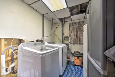 a laundry room with two washer and dryer at Cozy A-Frame Cabin with Pool Table 8 Mi to Mt Snow! in Wilmington
