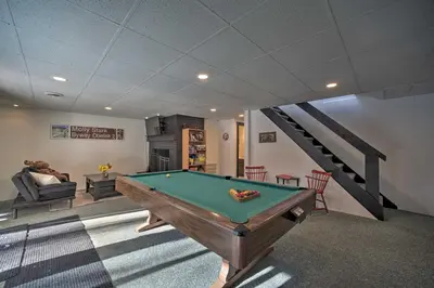 a room with a pool table and a staircase at Cozy A-Frame Cabin with Pool Table 8 Mi to Mt Snow! in Wilmington