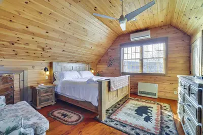 a bedroom with a bed in a wooden cabin at Quiet Snow Estate Retreat in the Poconos in Nay Aug