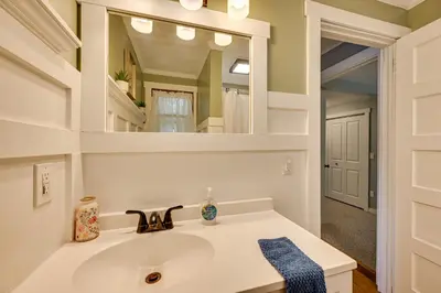 a bathroom with a sink and a mirror at Lakefront Granby Escape with Private Dock and Kayaks! in Granby
